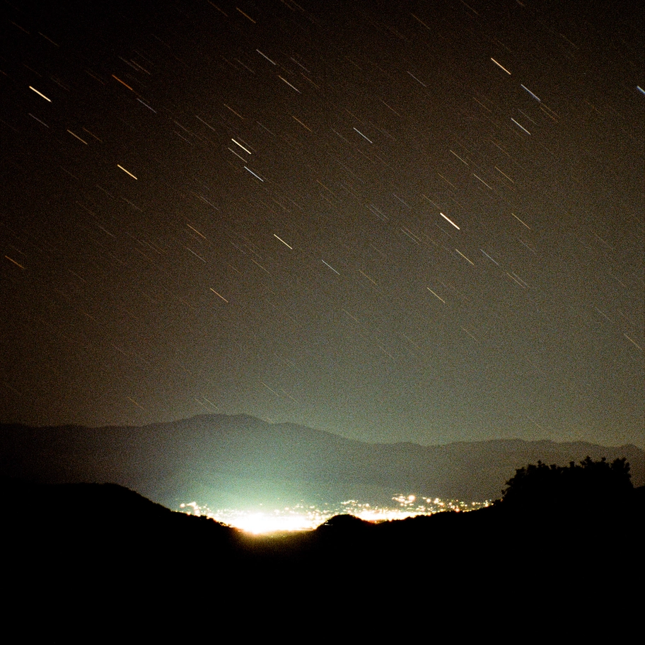 A photo of stars streaking over Ashland, Oregon