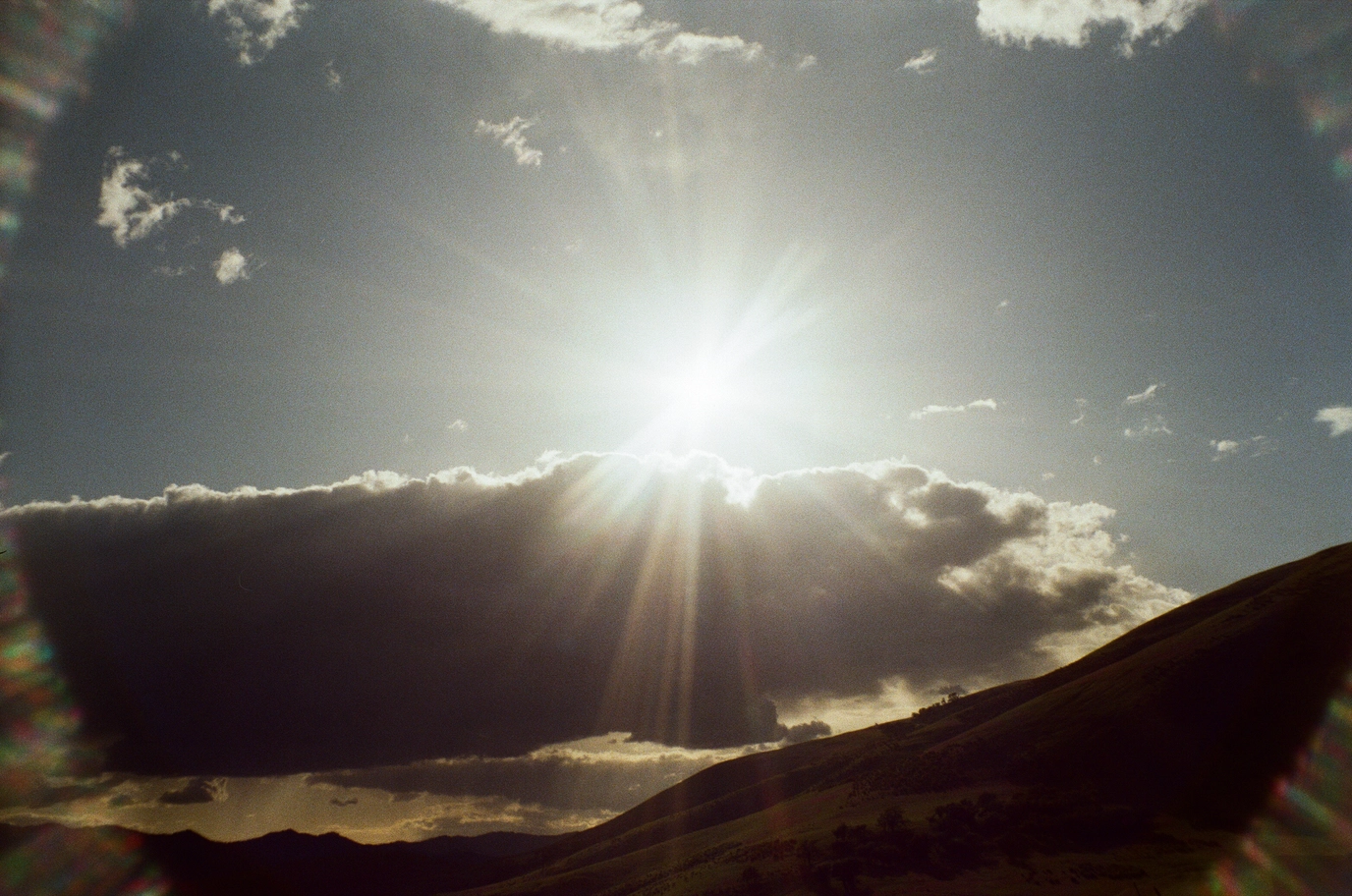 A photo of the sun and clouds