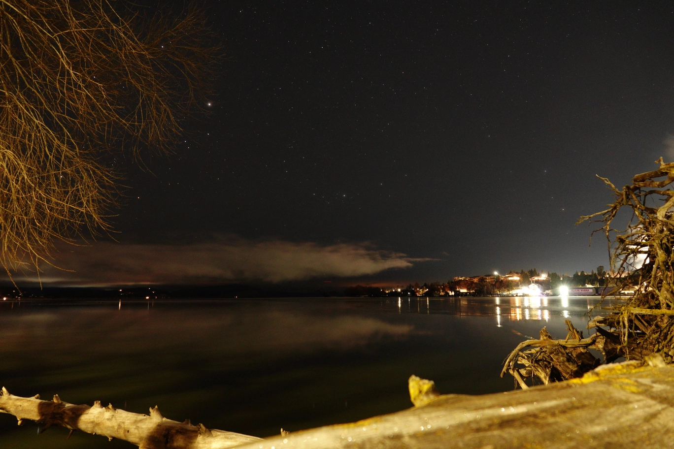 A photo of a lake at night
