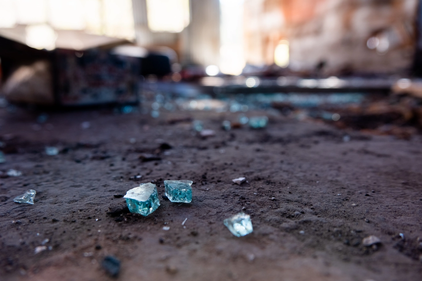 A macro shot of broken glass in an abandoned building