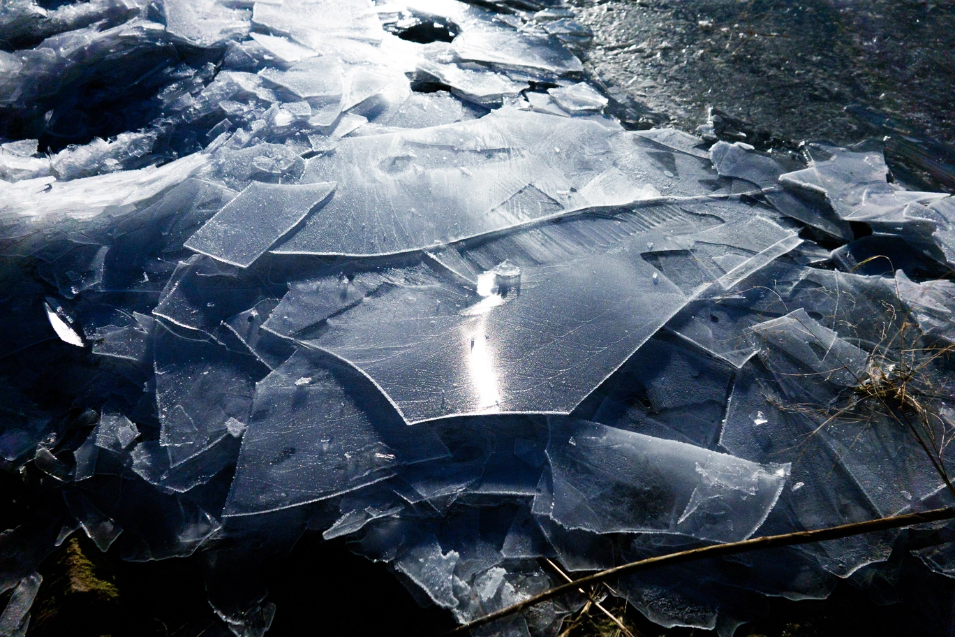 A photo of ice sheets under moonlight