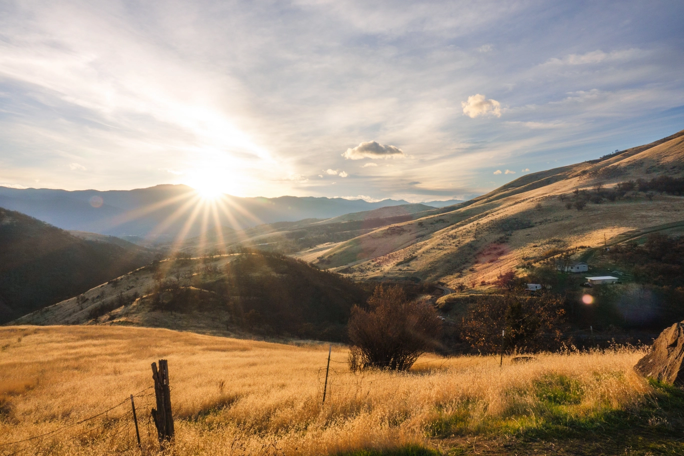 A photo of the sun setting over the rogue valley