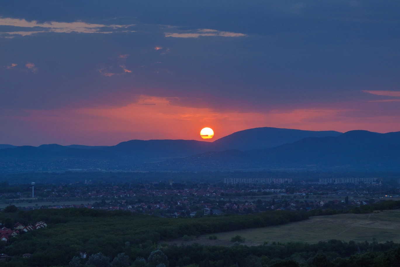 A photo of the sun on the horizon