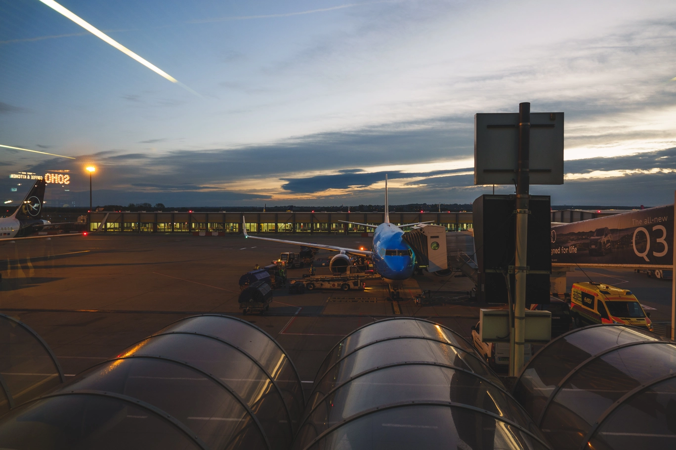 A photo of the sunrise at an airport
