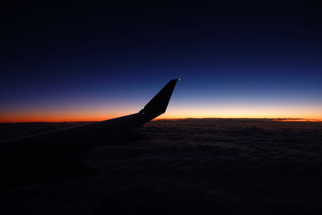 A photo of the sunset from an airplane window