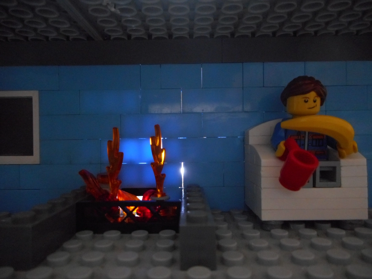 A photo of light shining through a lego wall and fireplace