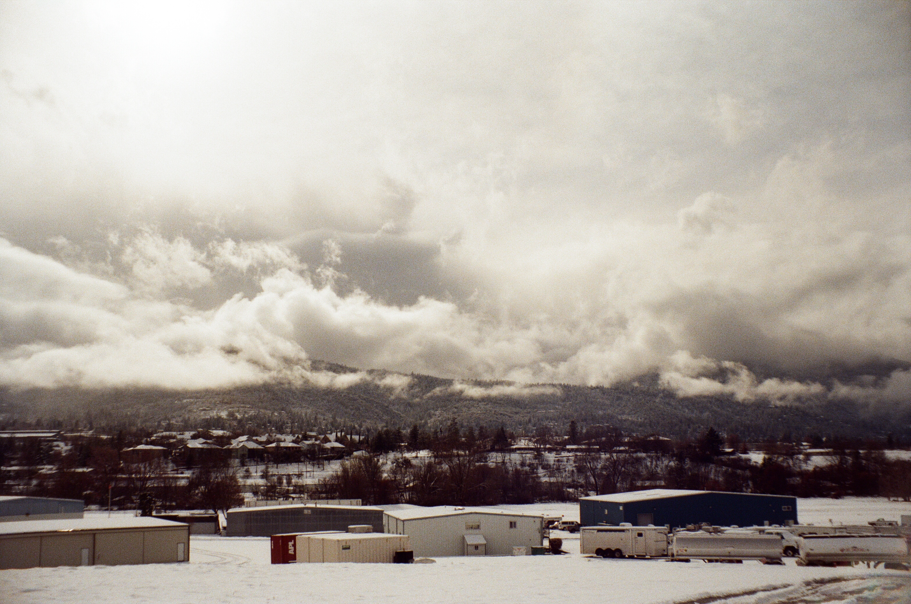 A photo of snowy, cloudy landscape