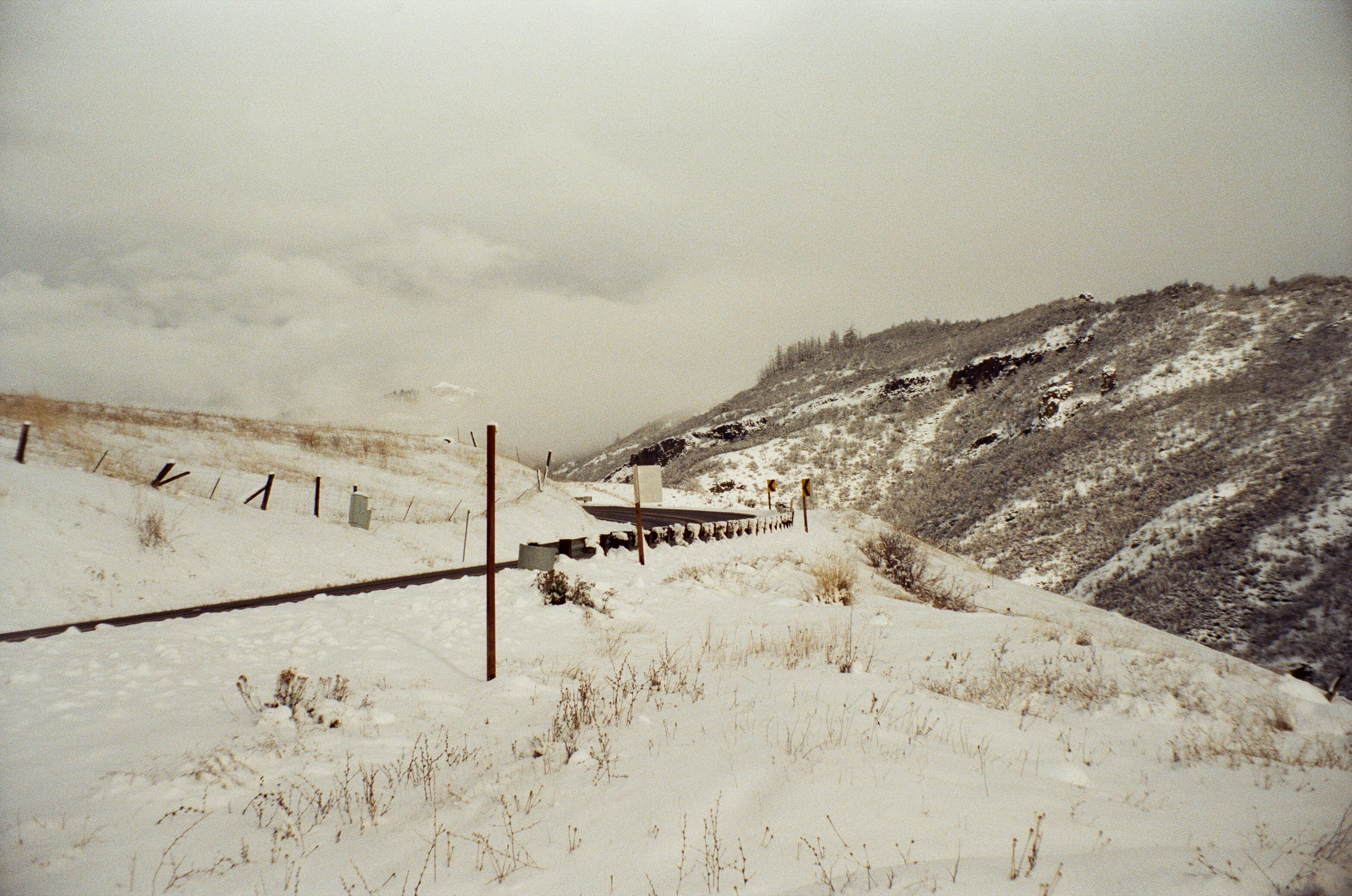 A photo of a snowy mountain road