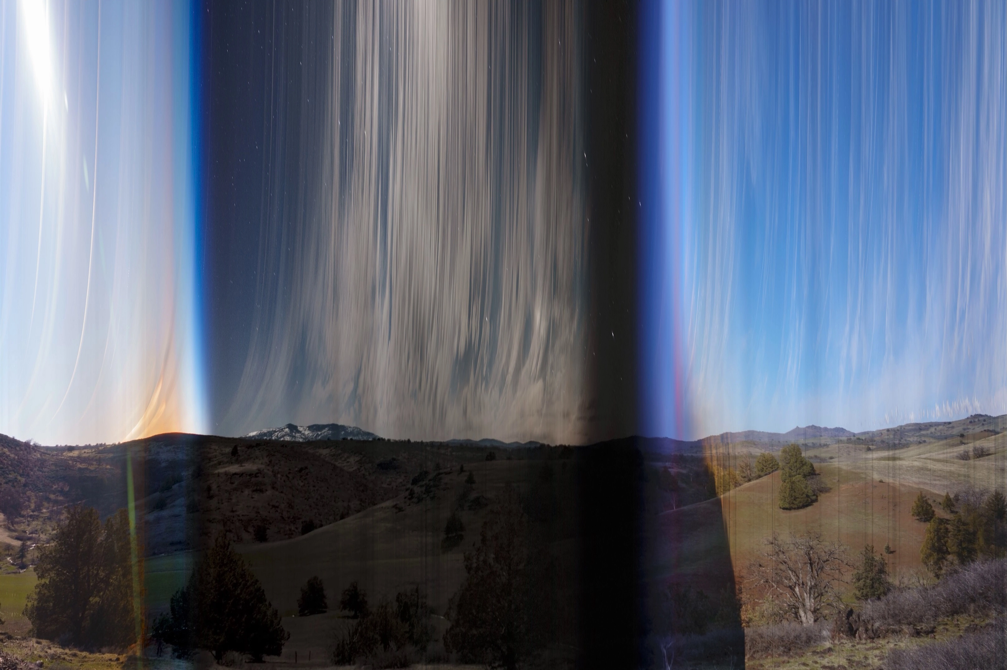 A slit scan photo of some hills over a 24 hour period