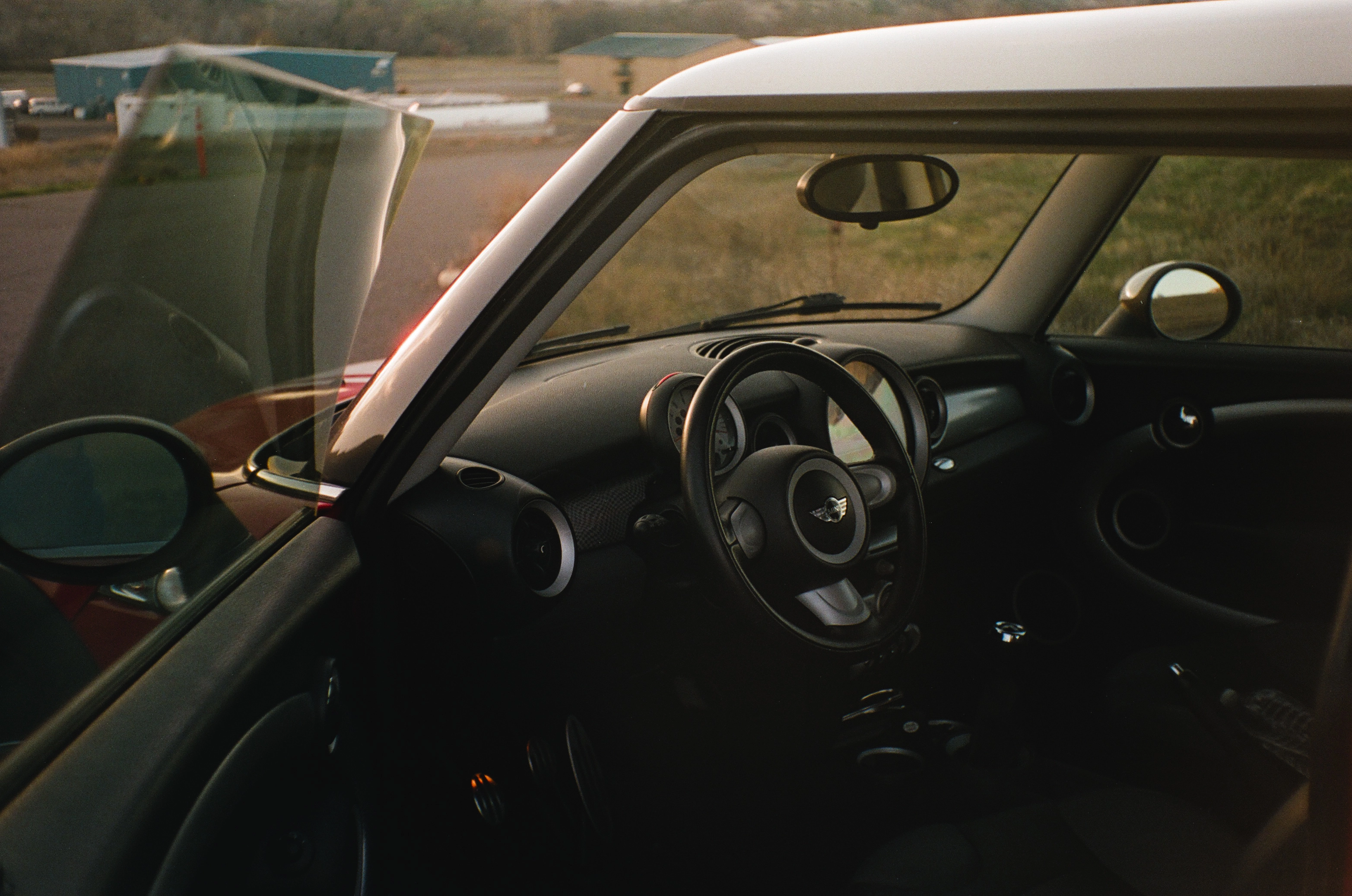 A photo of the interior of a red mini cooper