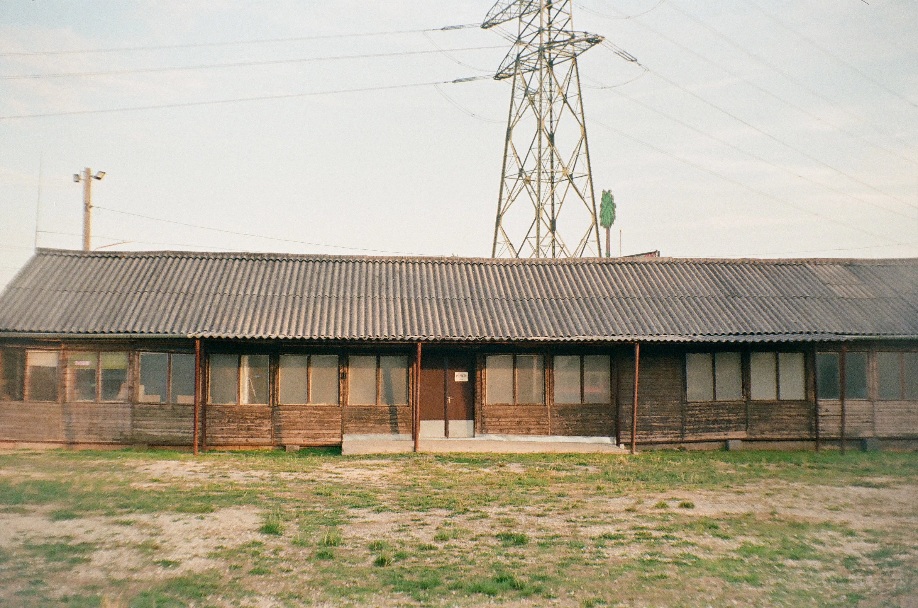 A photo of a long brown building