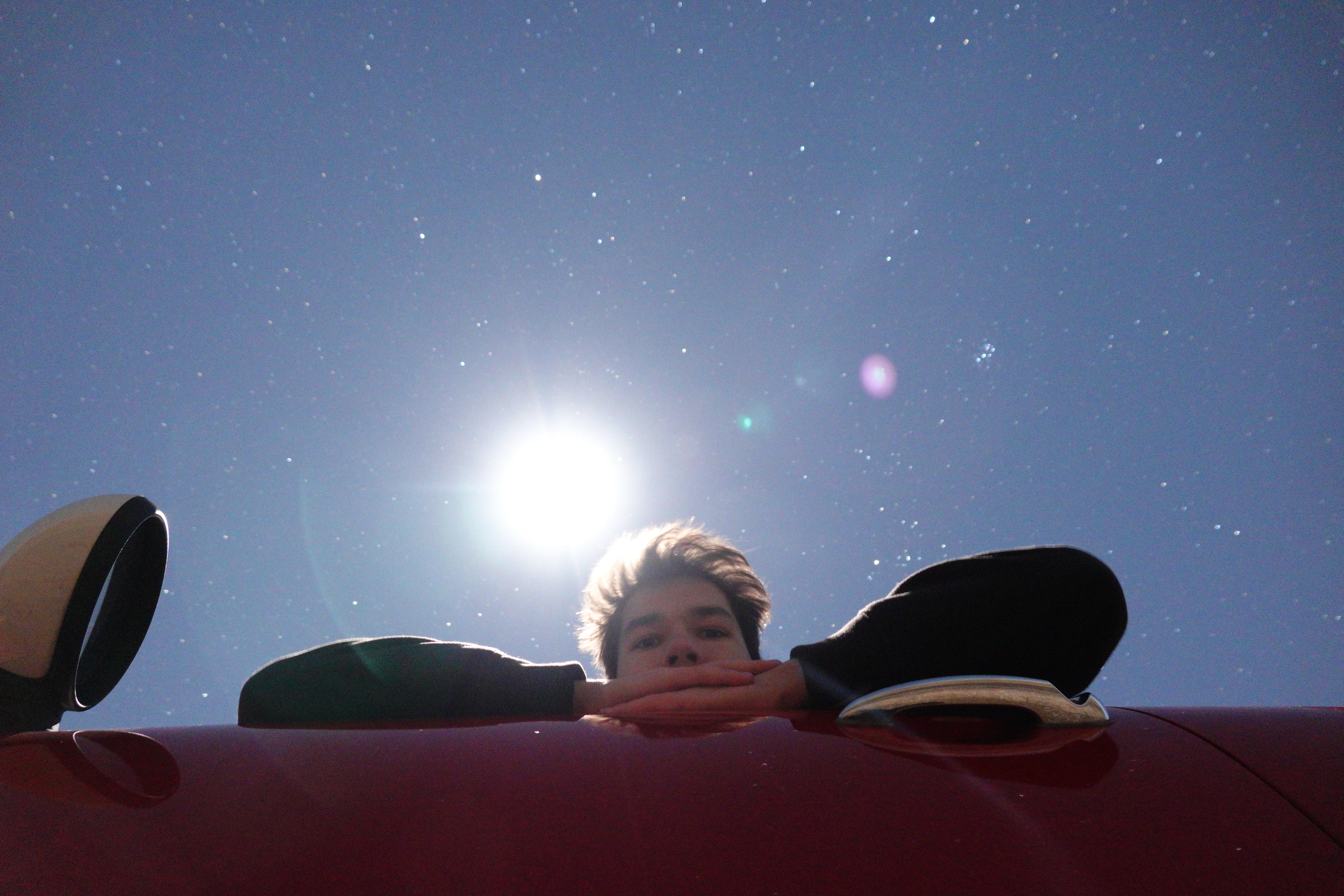 A photo of Levin Kiss with the moon and stars behind him