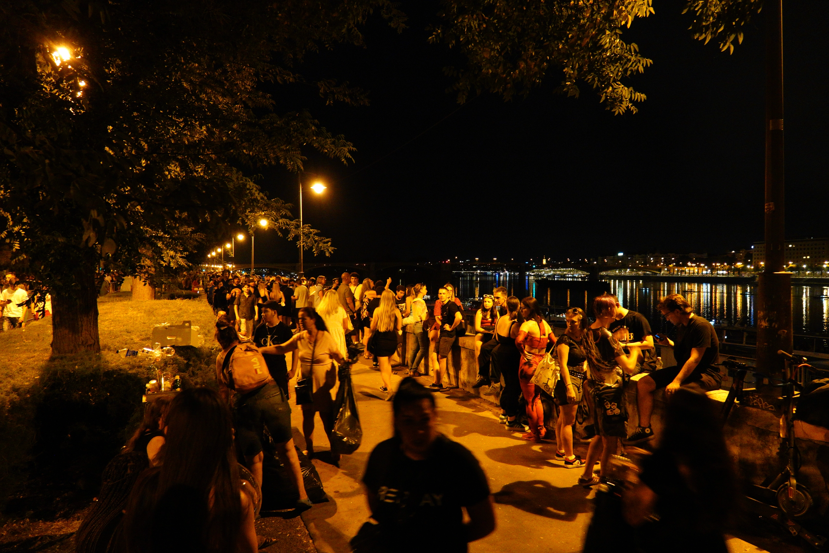 A photo of a crowd of people on the street