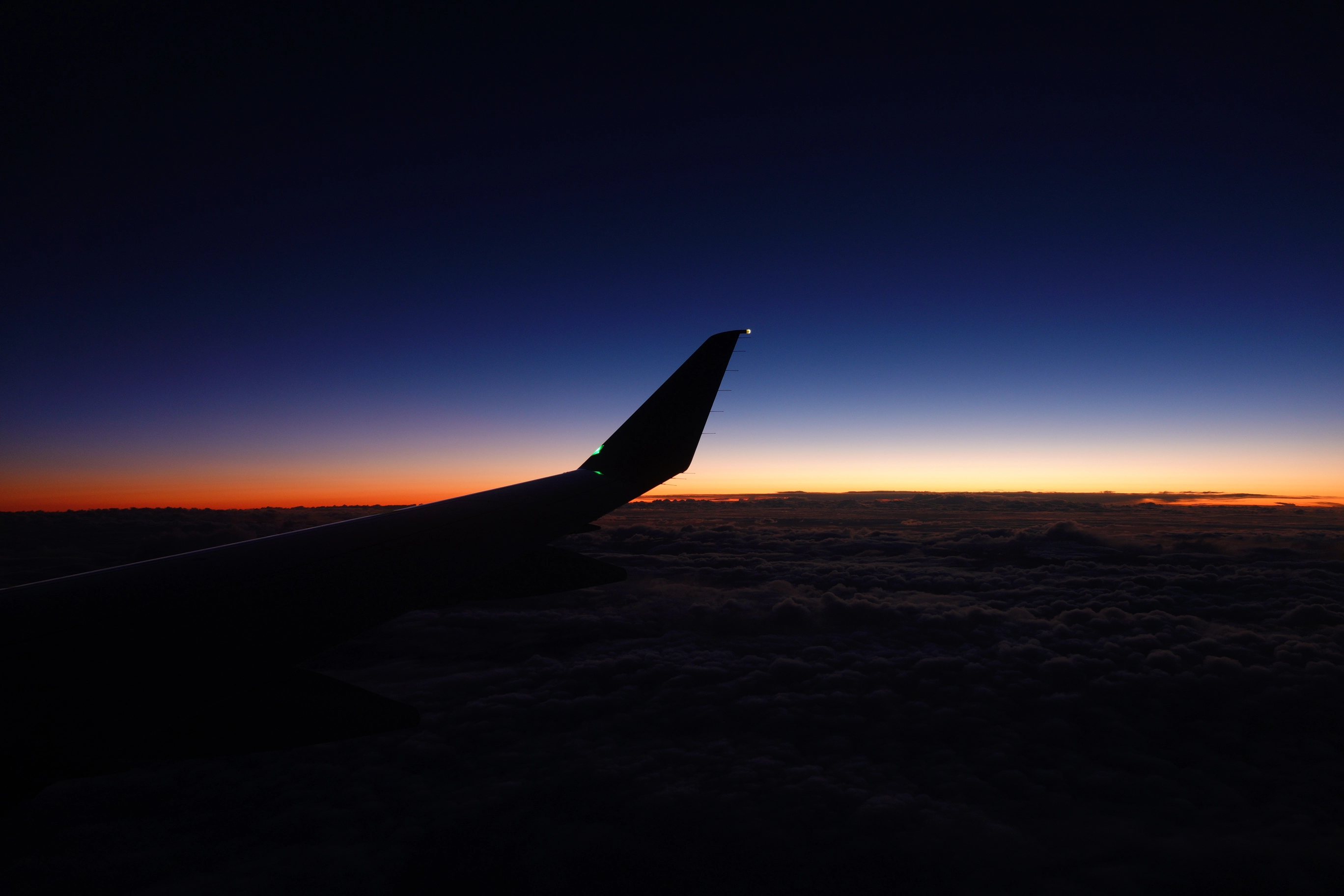 A photo of the sunset from an airplane window