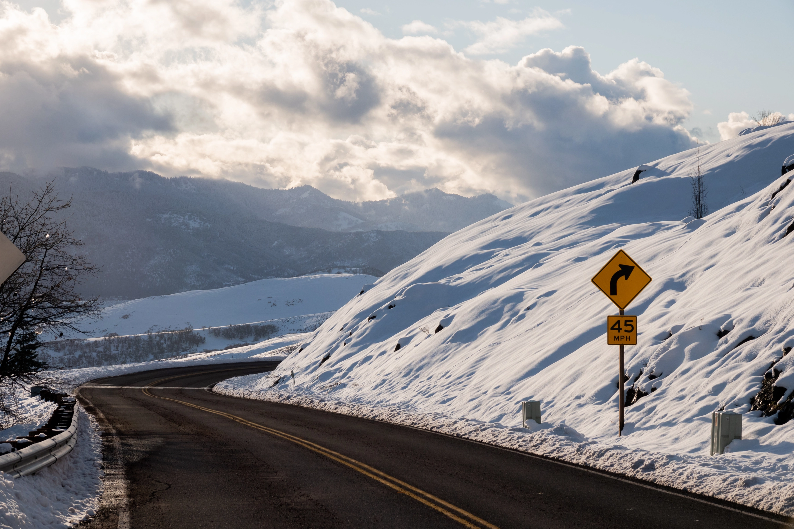 A photo of a snowy mountain road