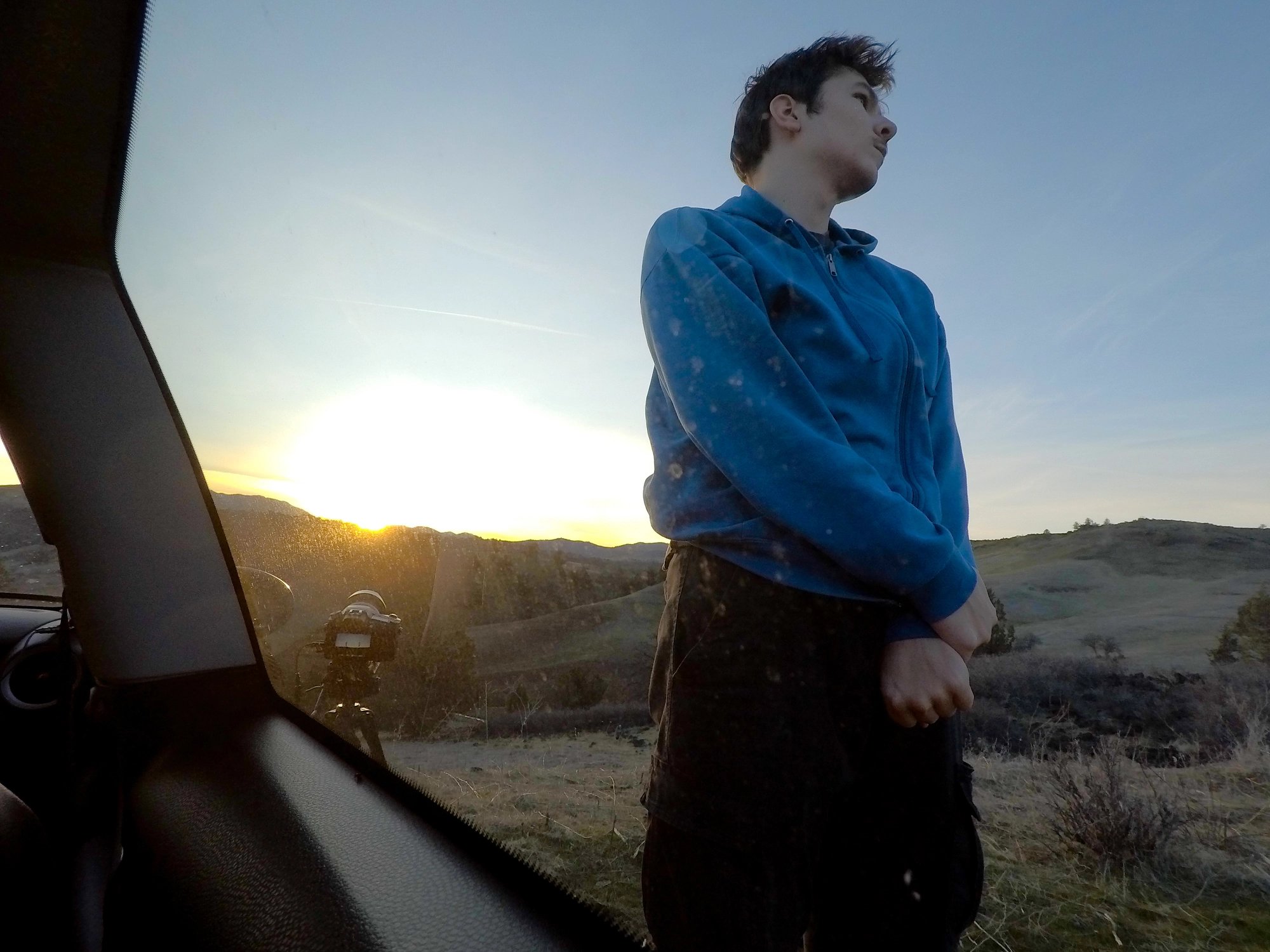 A photo of Levin Kiss filming a timelapse during sunset